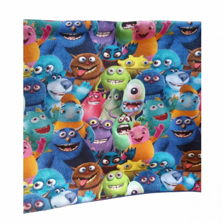 Cuello polar infantil con estampado de monstruos de colores, vista extendida de la tela.