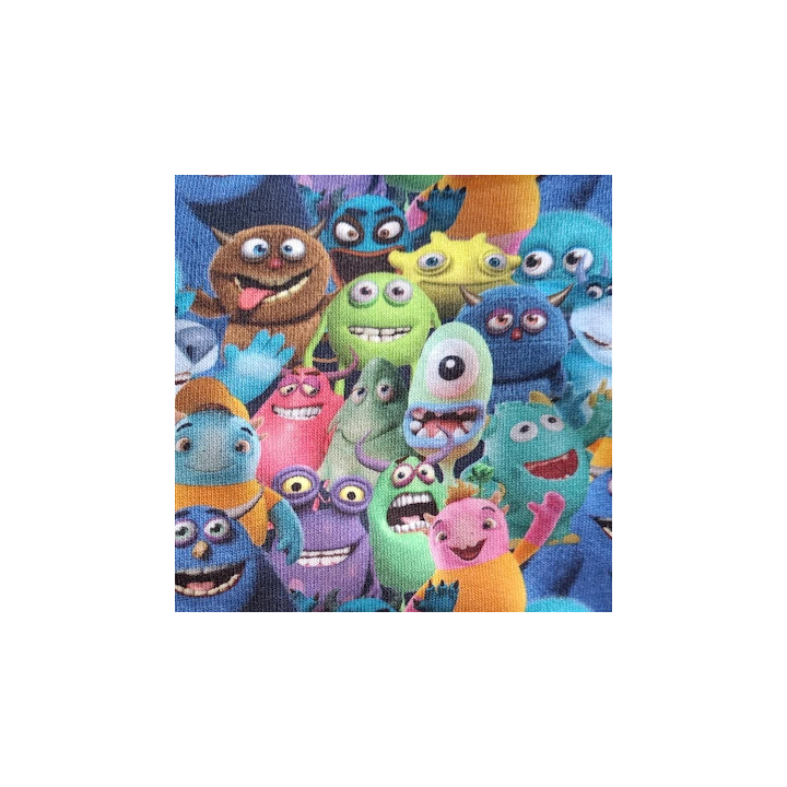Primer plano de la tela con monstruos de colores sonrientes y expresivos.