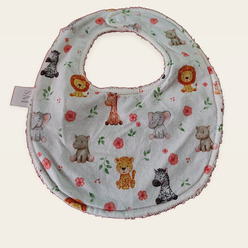 Babero impermeable 0–6 meses Animalitos de la sabana con rizo de algodón blanco roto, vista frontal