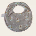 Babero impermeable 0–6 meses Animalitos del Ártico con rizo de algodón blanco roto, vista frontal