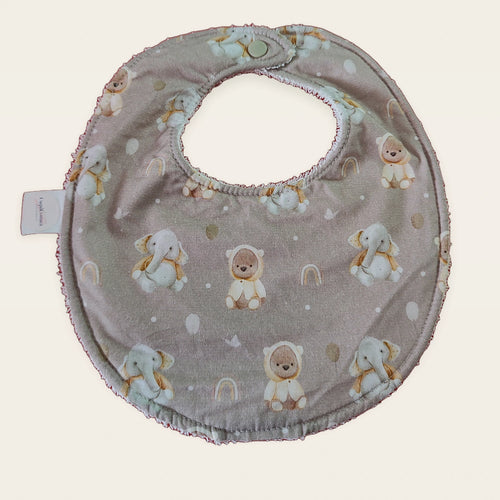 Babero impermeable 0–6 meses Animalitos del Ártico con rizo de algodón blanco roto, vista frontal
