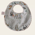 Babero impermeable 0–6 meses Bosque encantado con rizo de algodón blanco roto, vista frontal