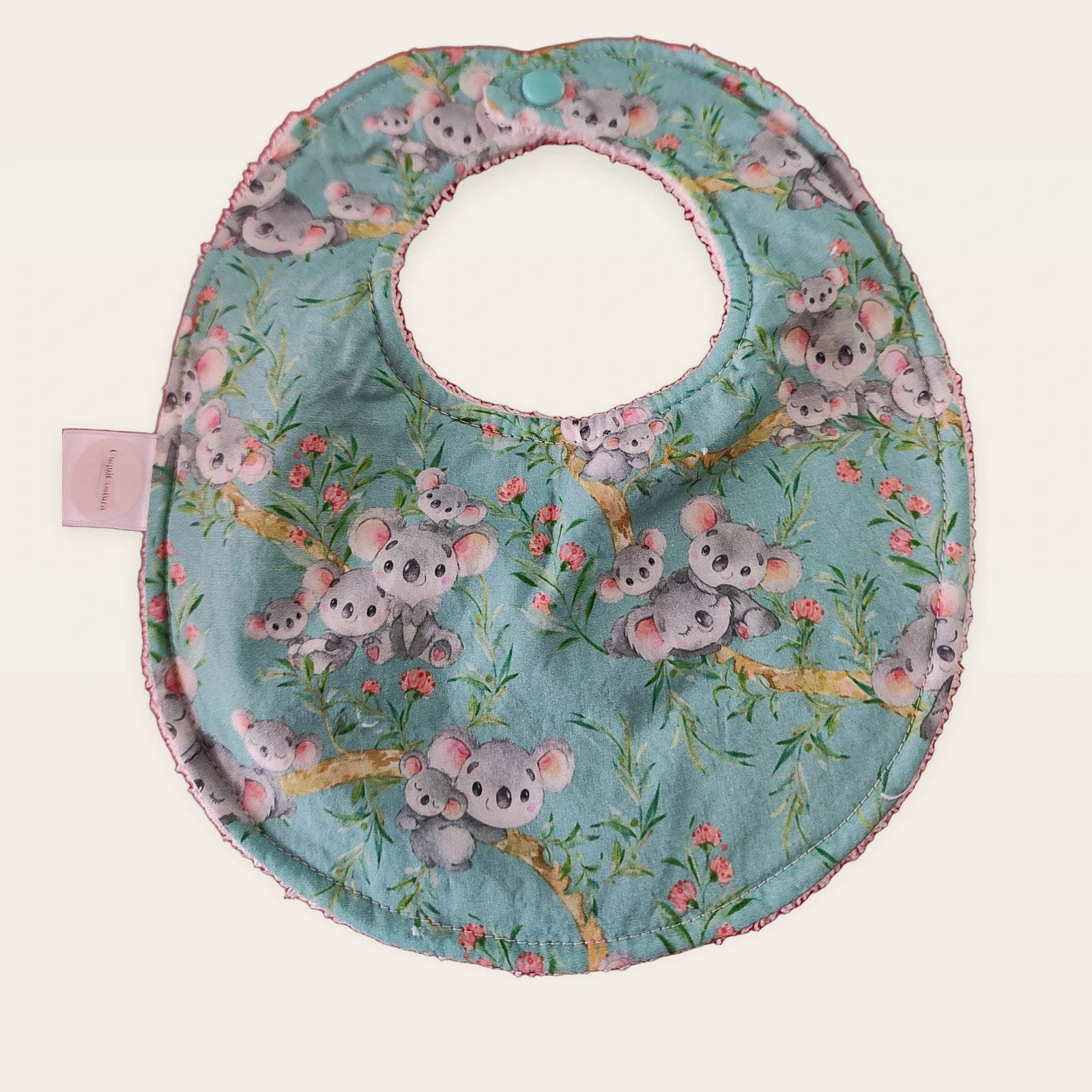 Babero impermeable 0–6 meses Koalas con rizo de algodón blanco roto, vista frontal
