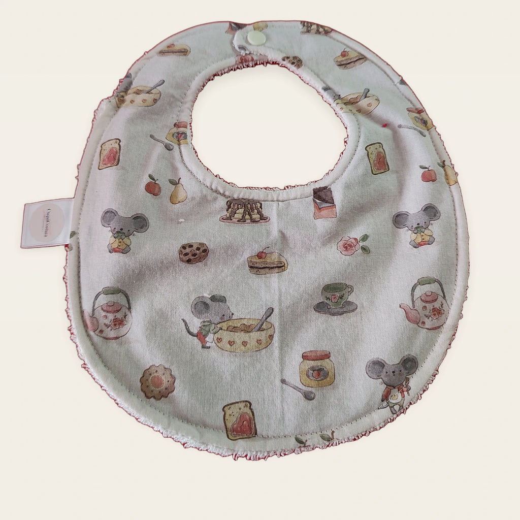 Babero impermeable 0–6 meses Ratitas reposteras con rizo de algodón blanco roto, vista frontal