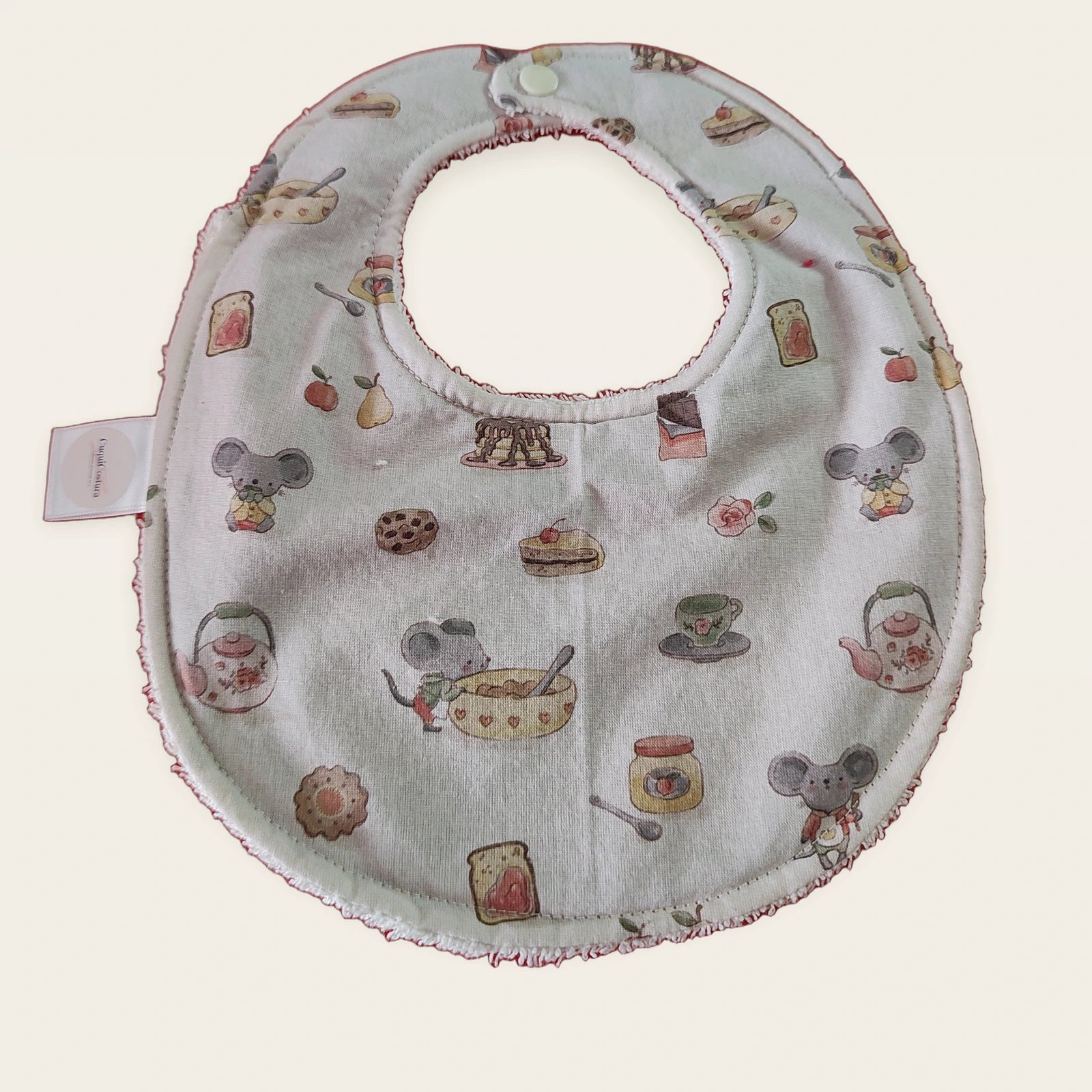 Babero impermeable 0–6 meses Ratitas reposteras con rizo de algodón blanco roto, vista frontal
