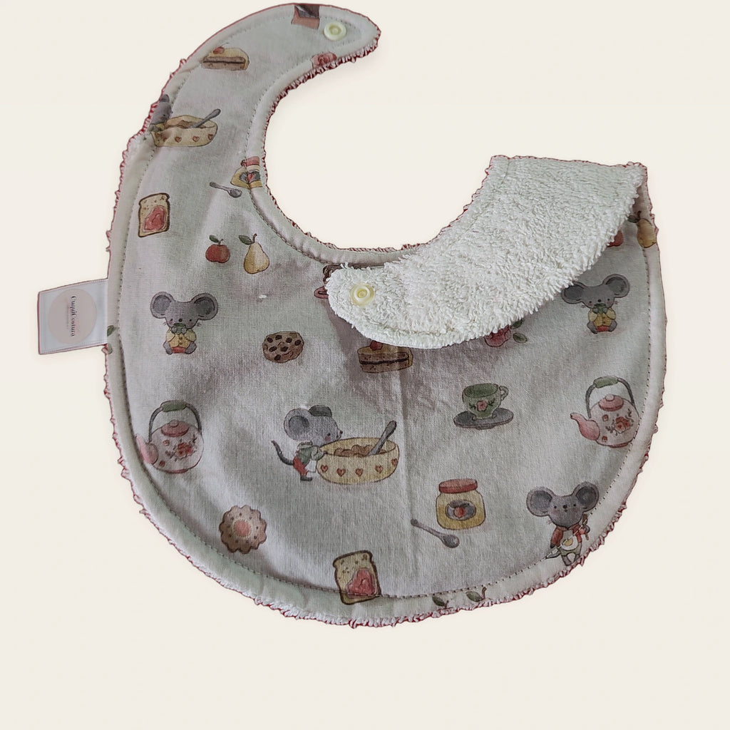 Babero impermeable 0–6 meses Ratitas reposteras con una pata doblada para mostrar el rizo de algodón blanco roto