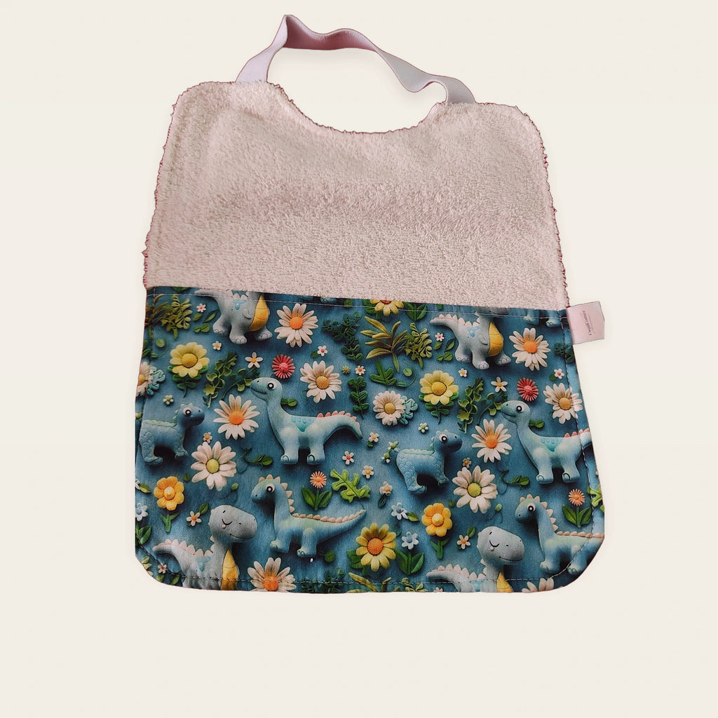 Babero infantil Dinosaurios y flores azul 3D con rizo de bambú blanco y cuello elástico
