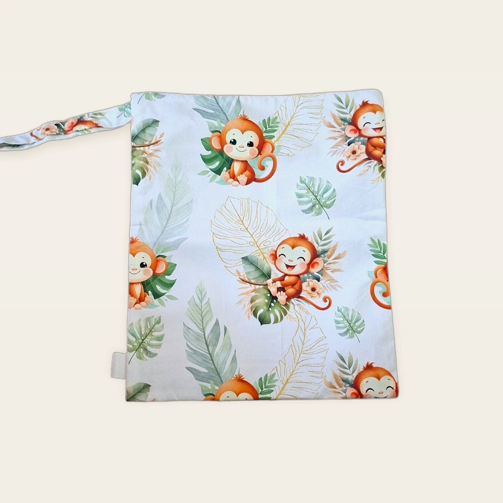 Bolsa impermeable Monitos tropicales con cremallera azul, vista trasera con asa