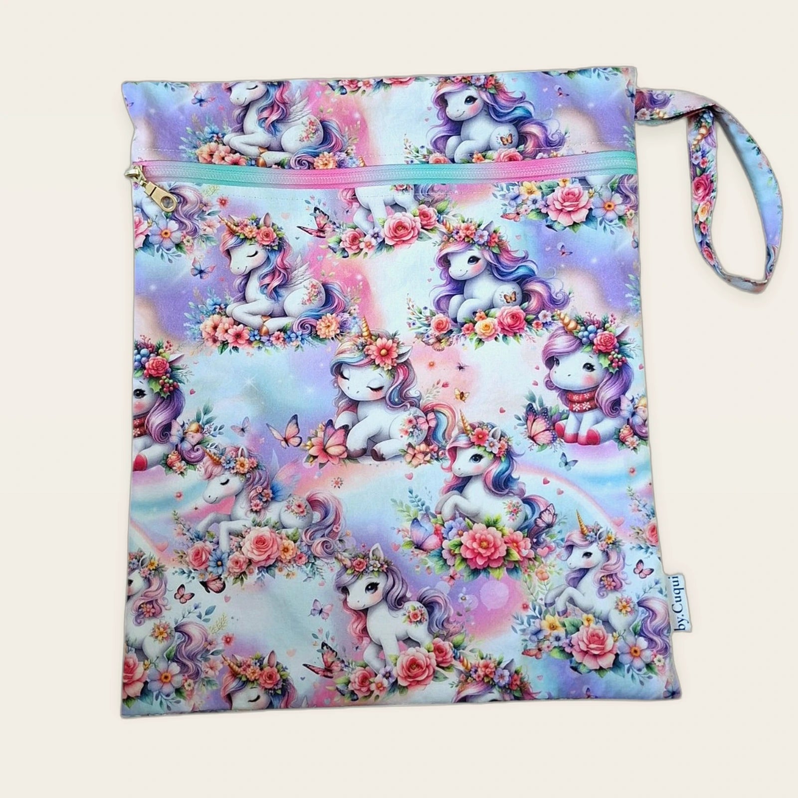Bolsa impermeable Unicornios florales con cremallera arcoíris, vista frontal