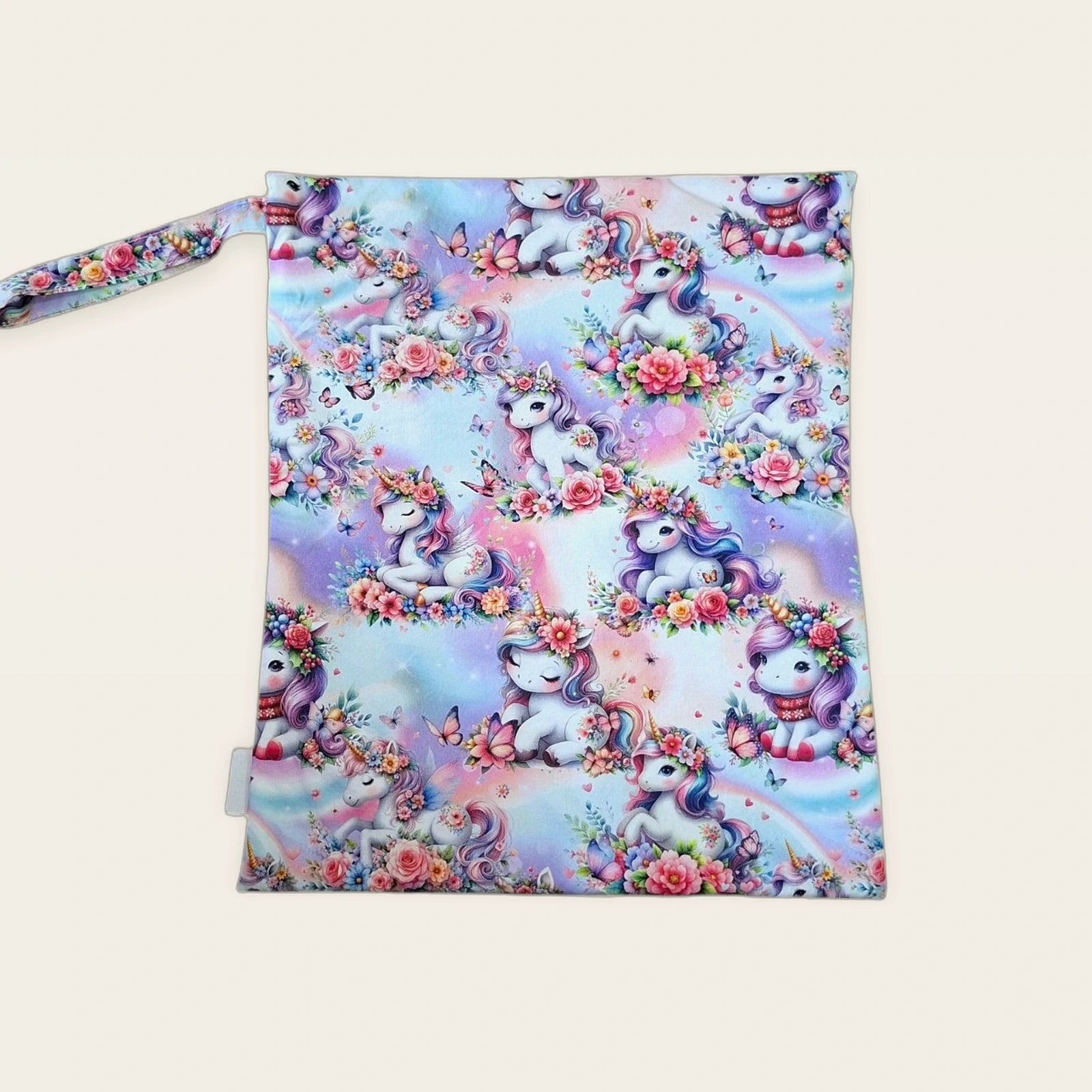 Bolsa impermeable Unicornios florales con cremallera blanca, vista frontal